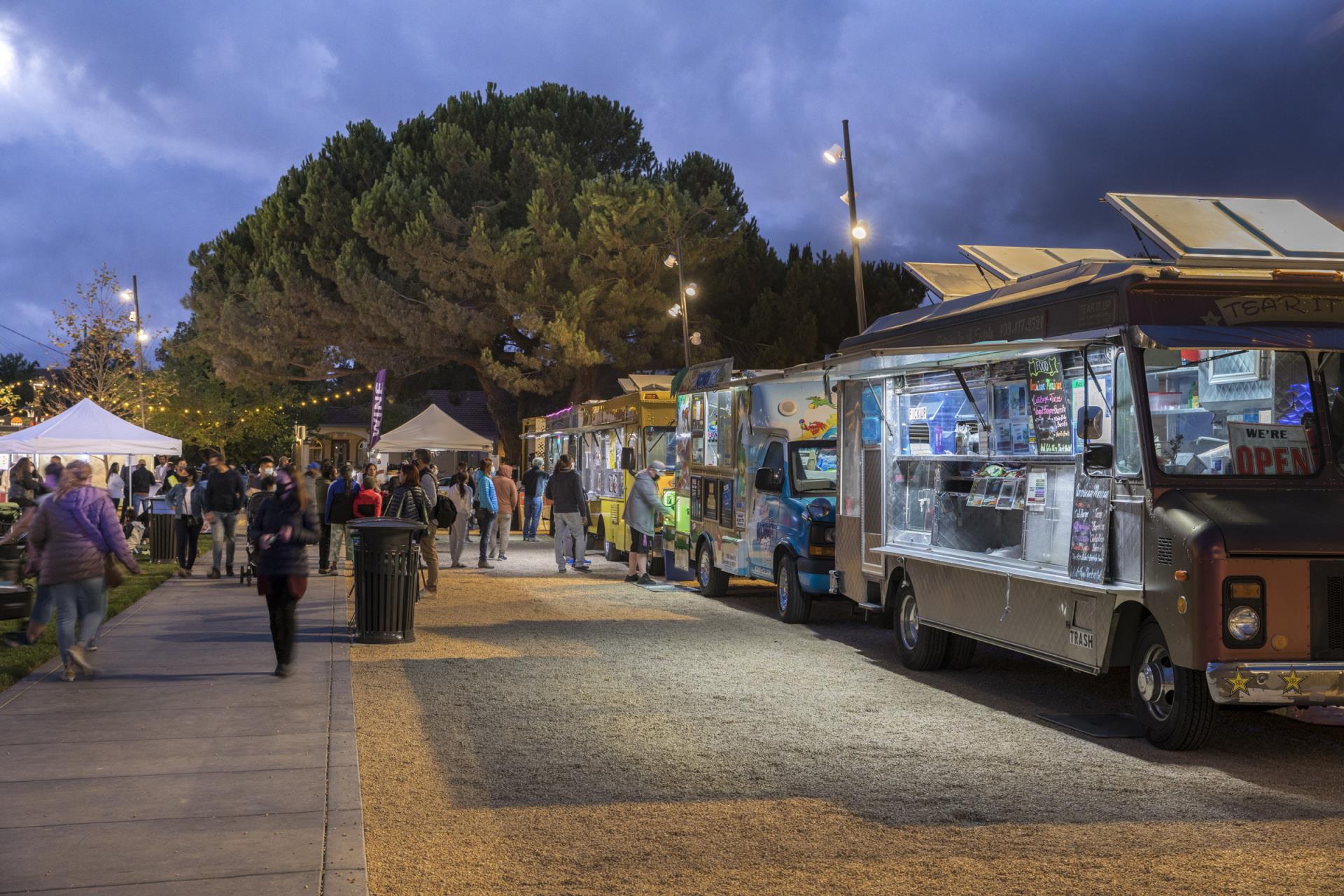 Food Trucks and people gathered at dusk